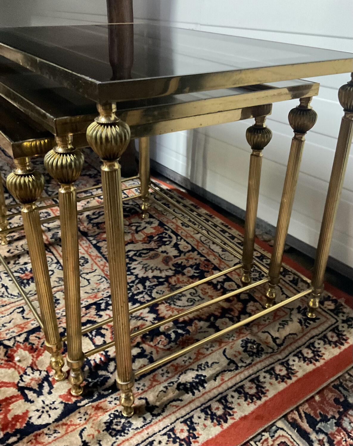 Series of 3 empire style nesting tables in brass and glass