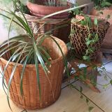 Two pot covers in Wicker, rope and wood.