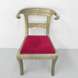 Dining chair upholstered with stamped tin