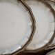 Service of 12 flat plates Salins France, taupe rim.