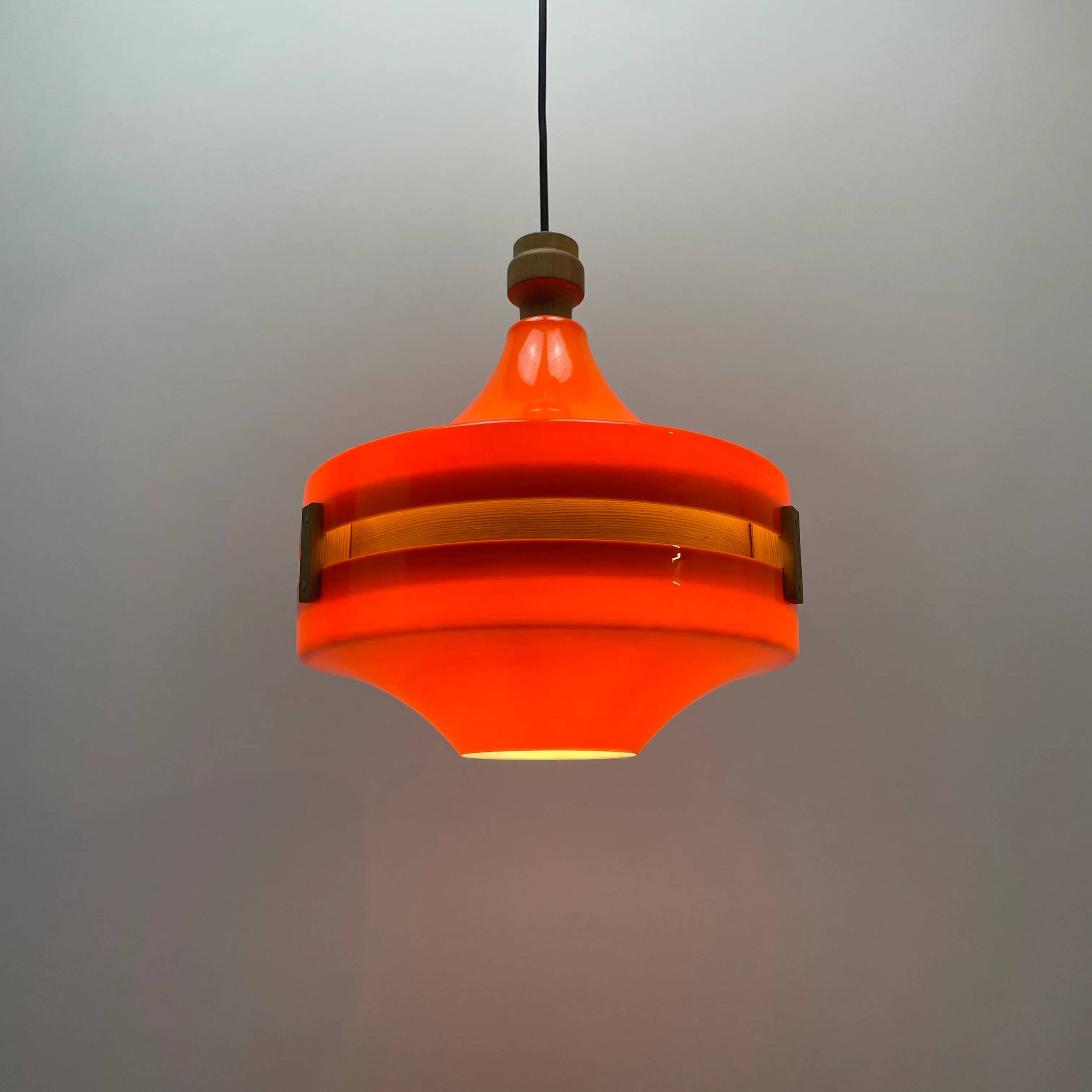 1970s orange Scandinavian suspension light in plexiglass shaped like a UFO.