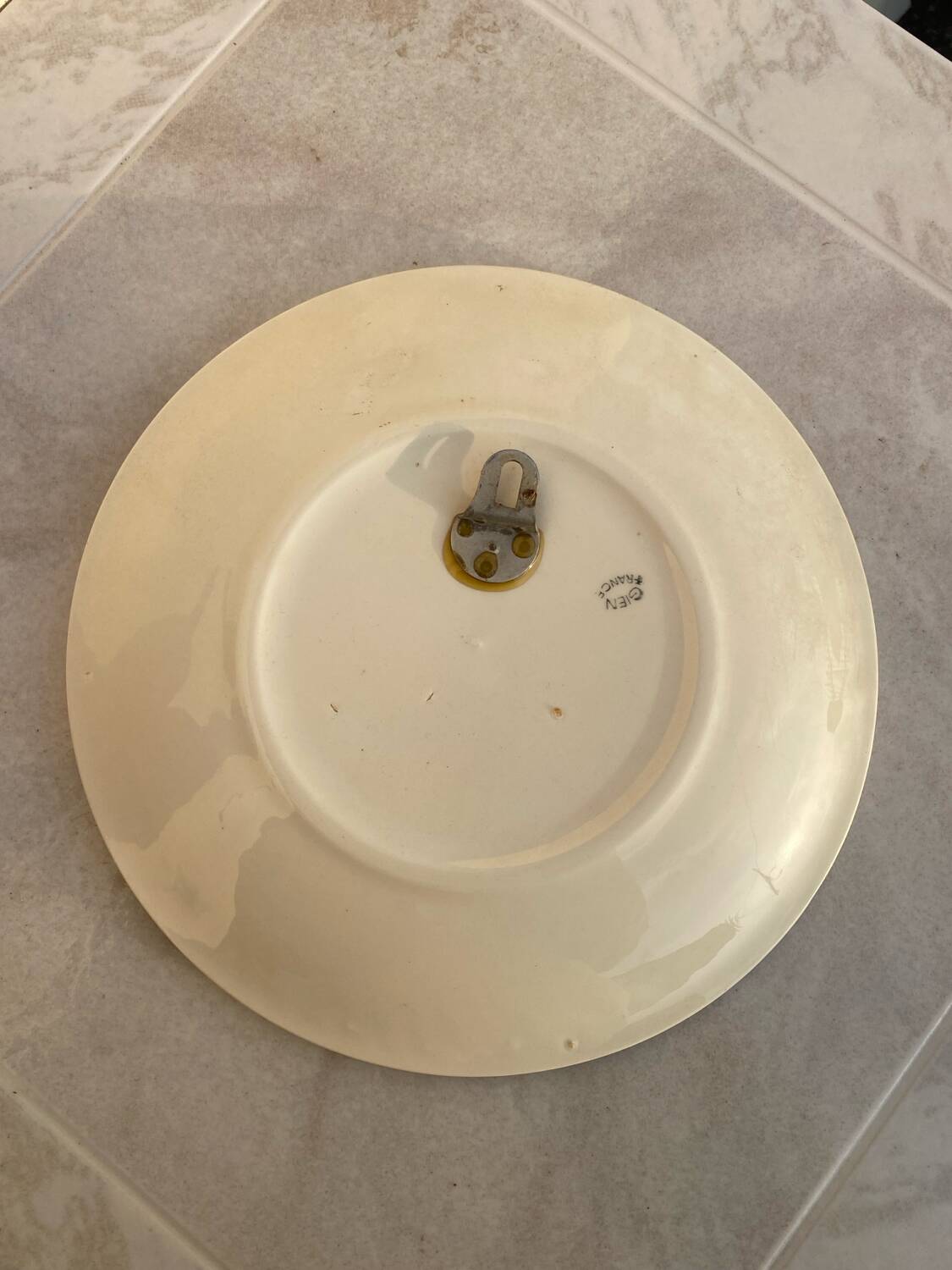 Relief plate horse Gien signed EB