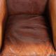 Vintage sheepskin club armchair finished with black piping