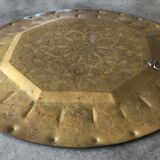 Oriental brass tray with chiseled decoration of arabesques and flowers