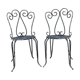 Pair of wrought iron garden chairs