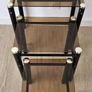 Set of 3 vintage nesting tables in smoked glass and black metal – 1970s