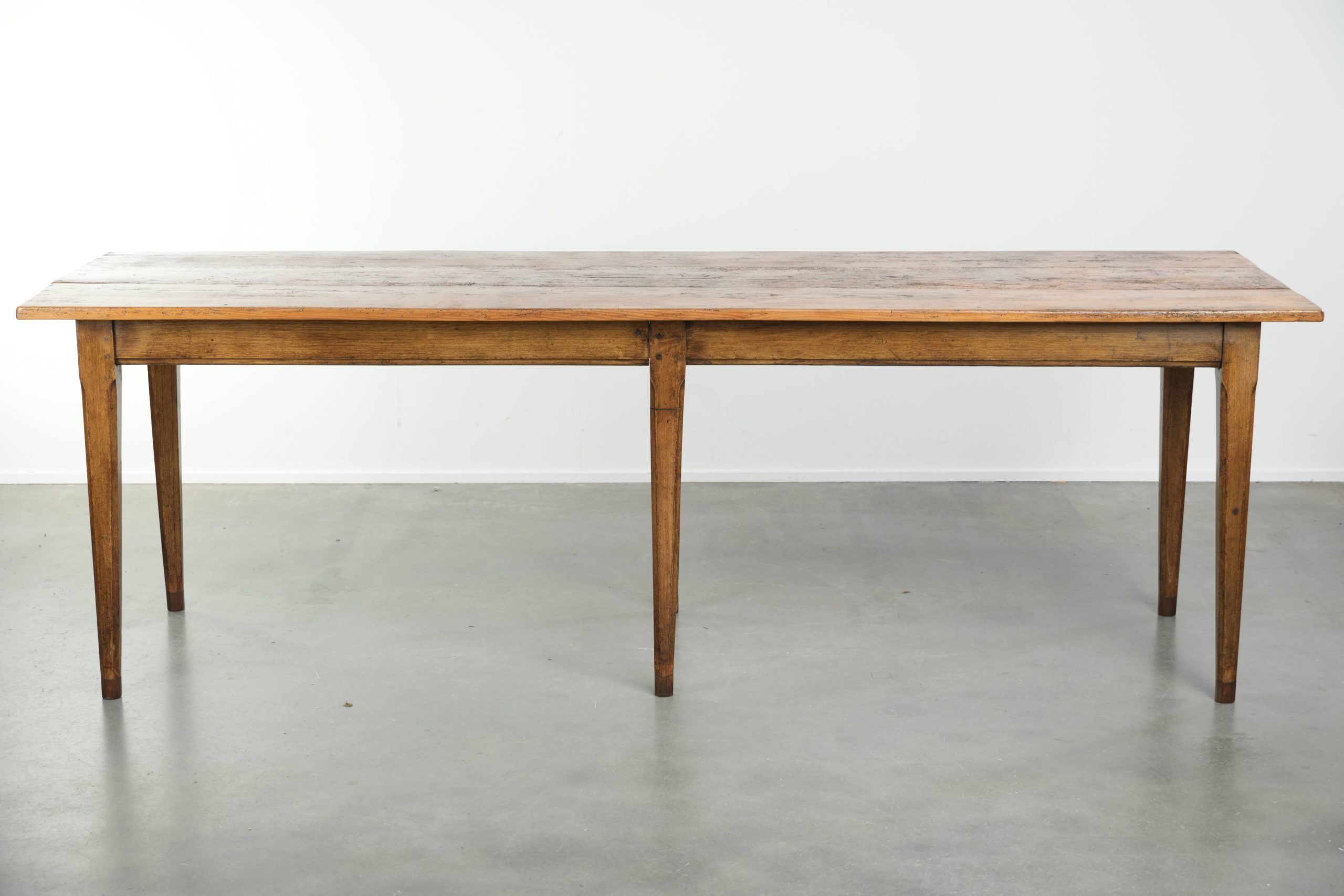 Antique French farmhouse dining table of pine wood from the 19th century
