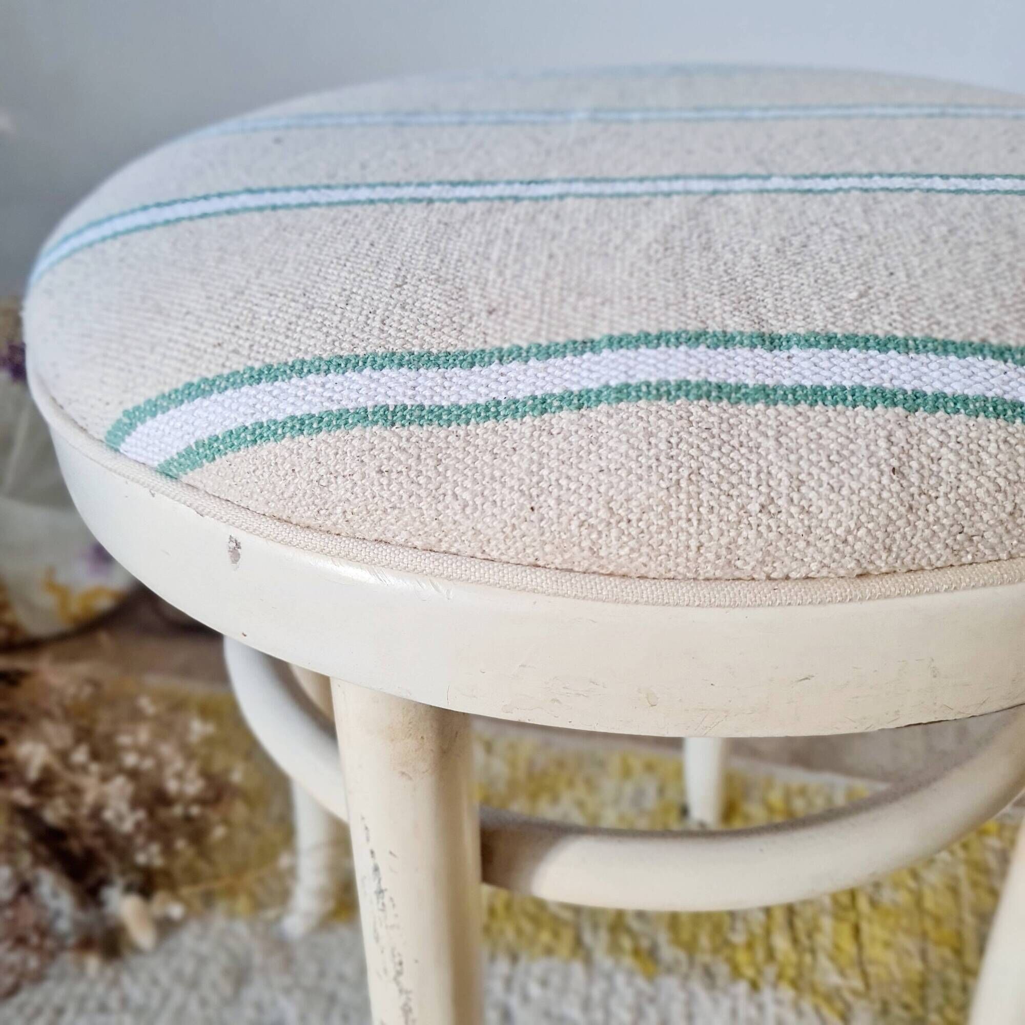 Vintage curved wooden stool in Baumann style, striped seat.