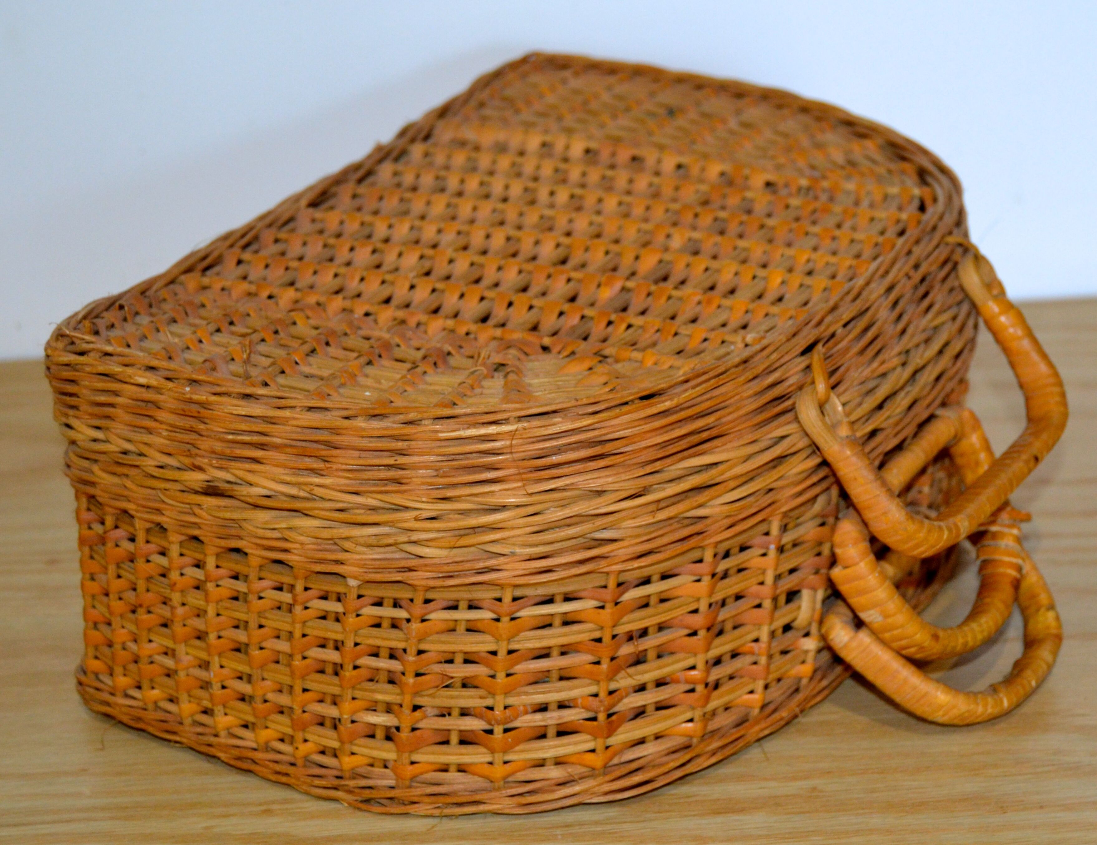 Half-moon rattan & wicker suitcase