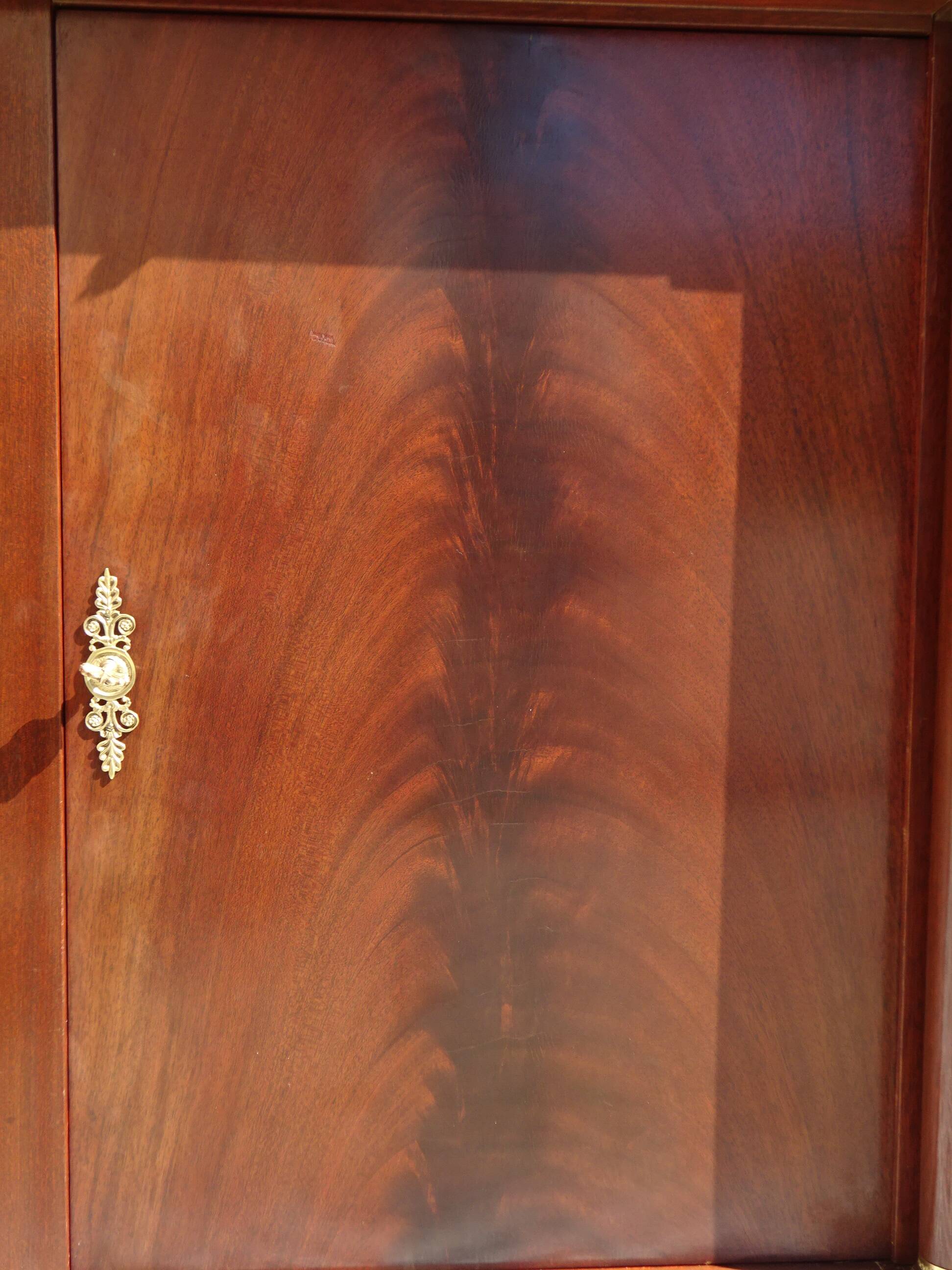 Flamed mahogany enfilade with sea green marble in Empire style.