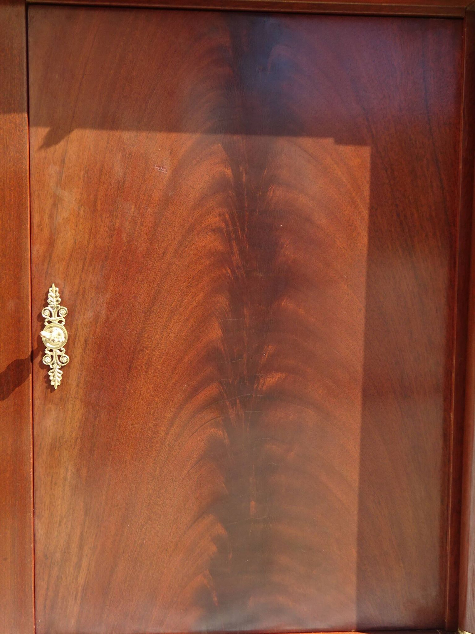 Flamed mahogany enfilade with sea green marble in Empire style.