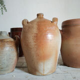 Ancient jar in varnished sandstone