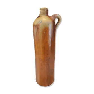 Old bottle in terracotta varnished finish