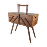 Worker on wooden compass feet