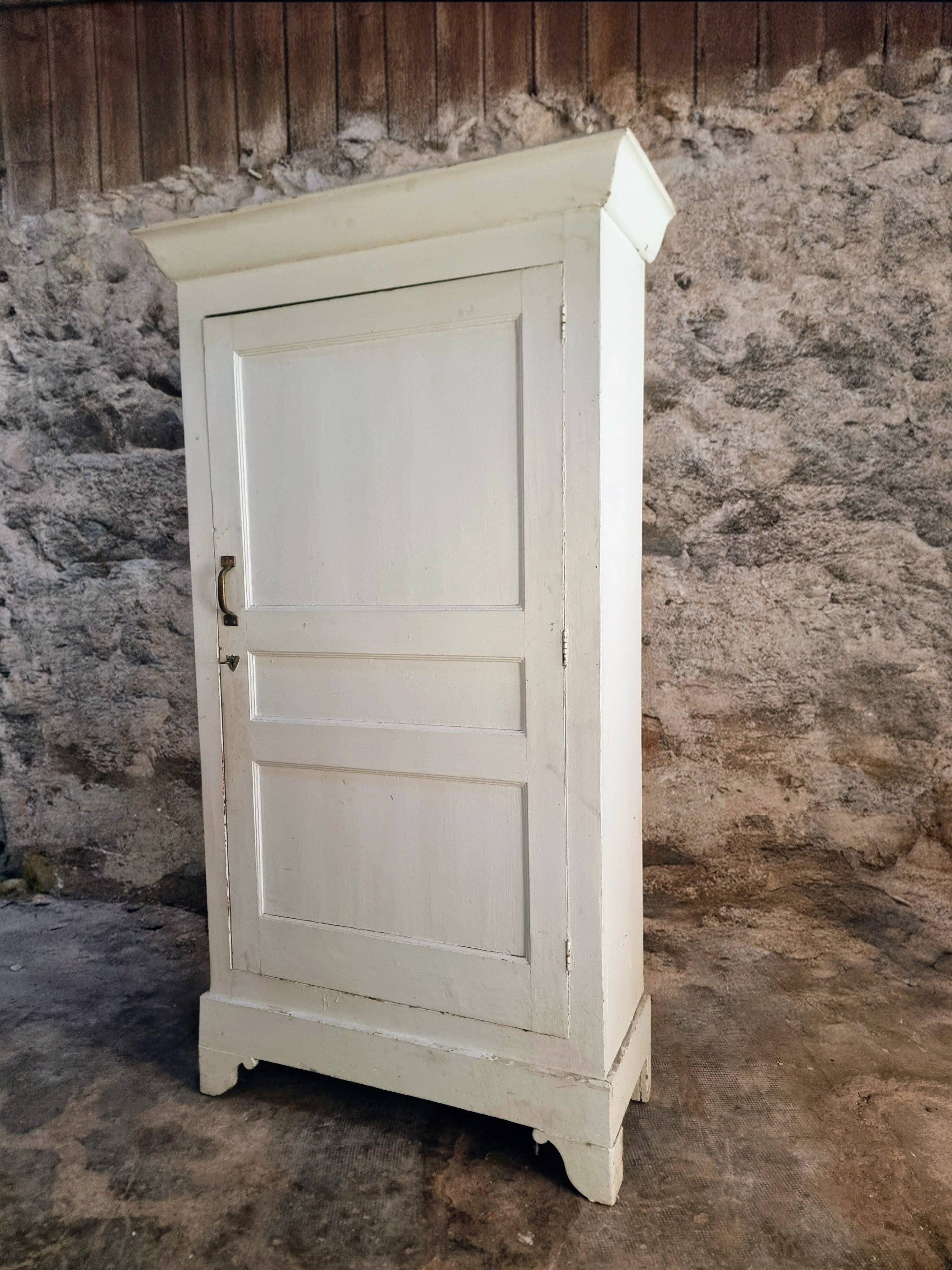Antique French pine wardrobe with original white paint, circa 1900–1920.