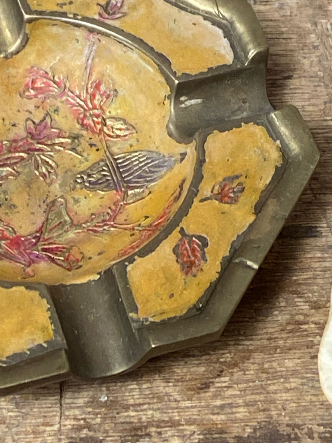 Enameled brass ashtray with floral decoration