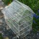 Old bird cage in the shape of a house