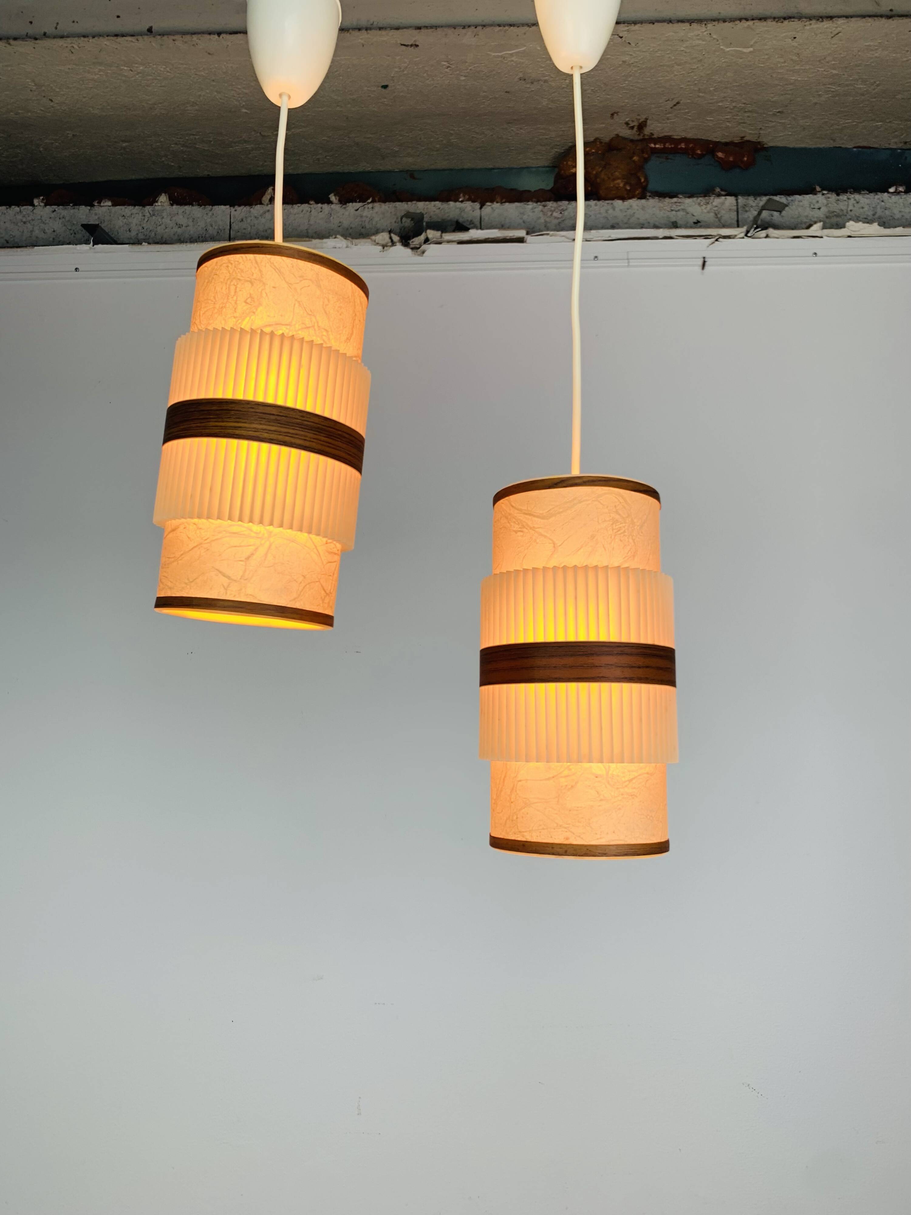 Pair of roller suspensions from the 70s, paper