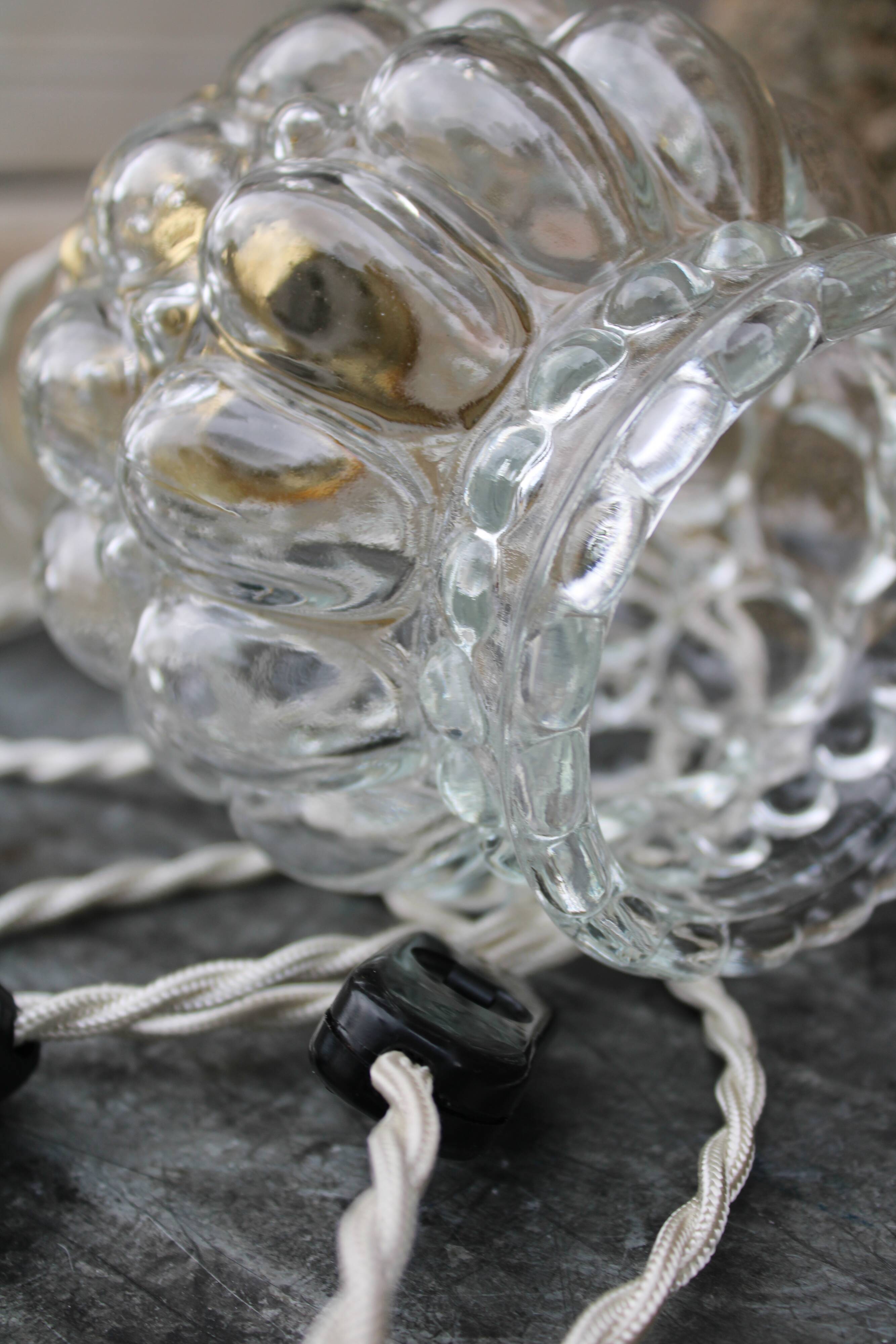 Moulded glass globe hand lamp