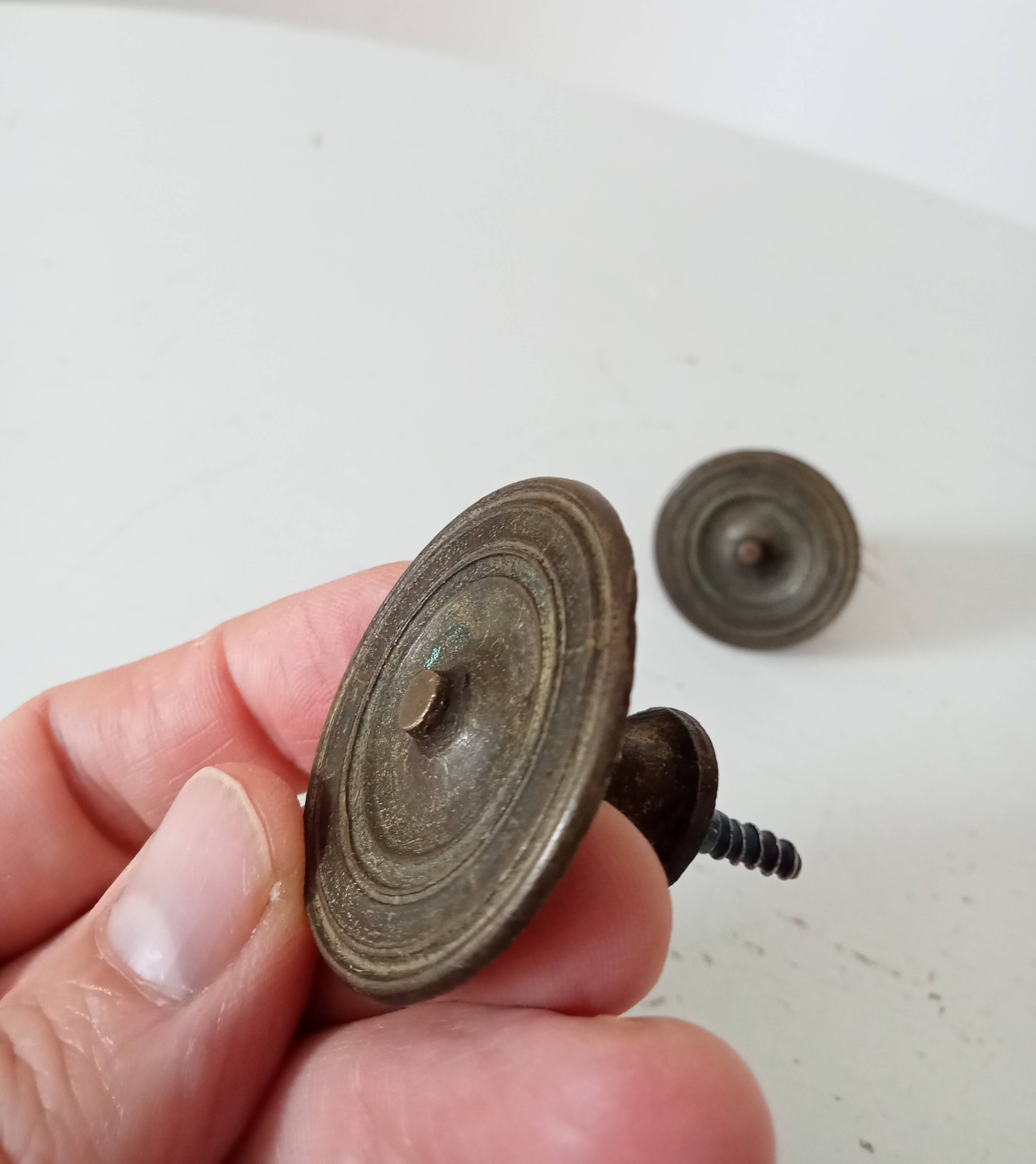 Pair of antique Empire furniture knobs from the 19th century.