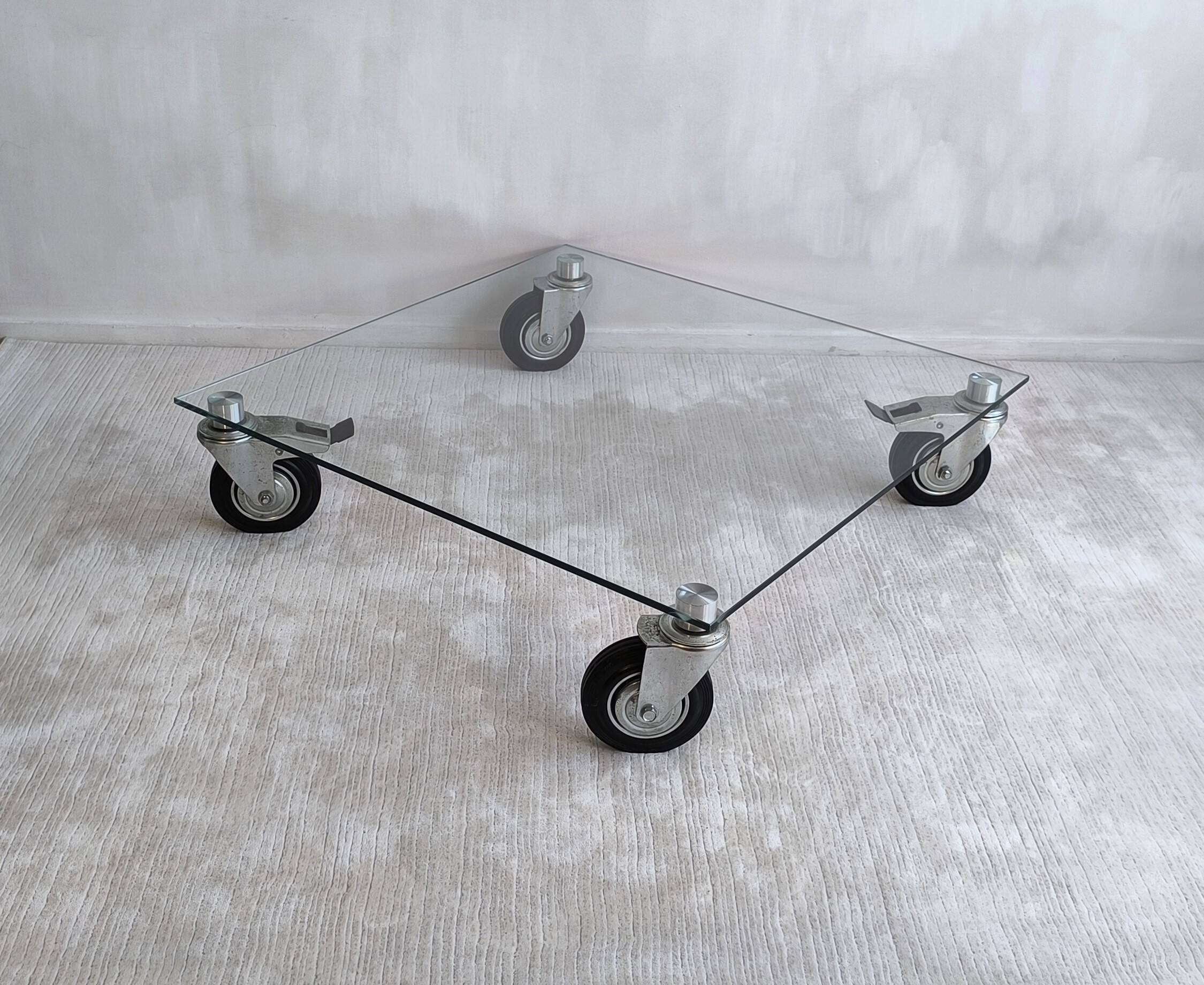 Beautiful designer glass coffee table on wheels
