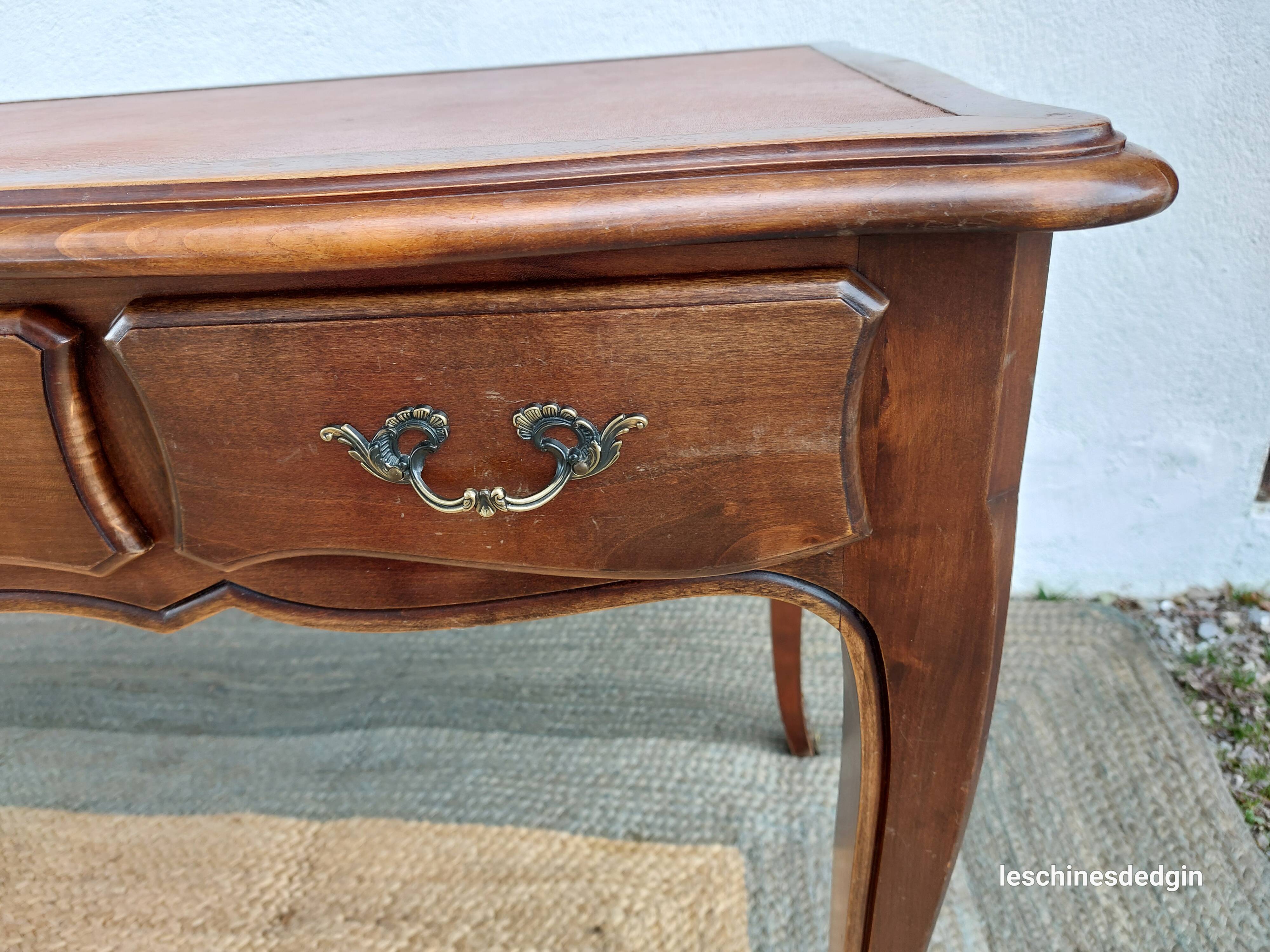 Louis XV style desk in wood, with a brown leather top.