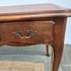 Louis XV style desk in wood, with a brown leather top.