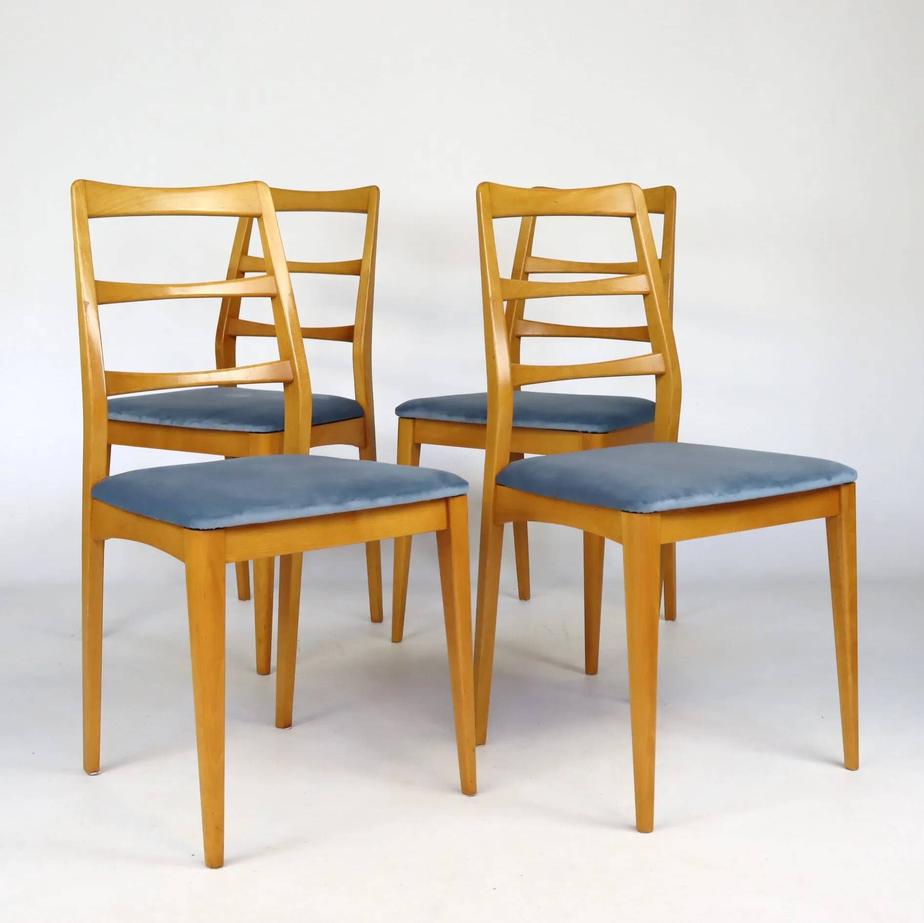 Set of four blue velvet Scandinavian chairs.