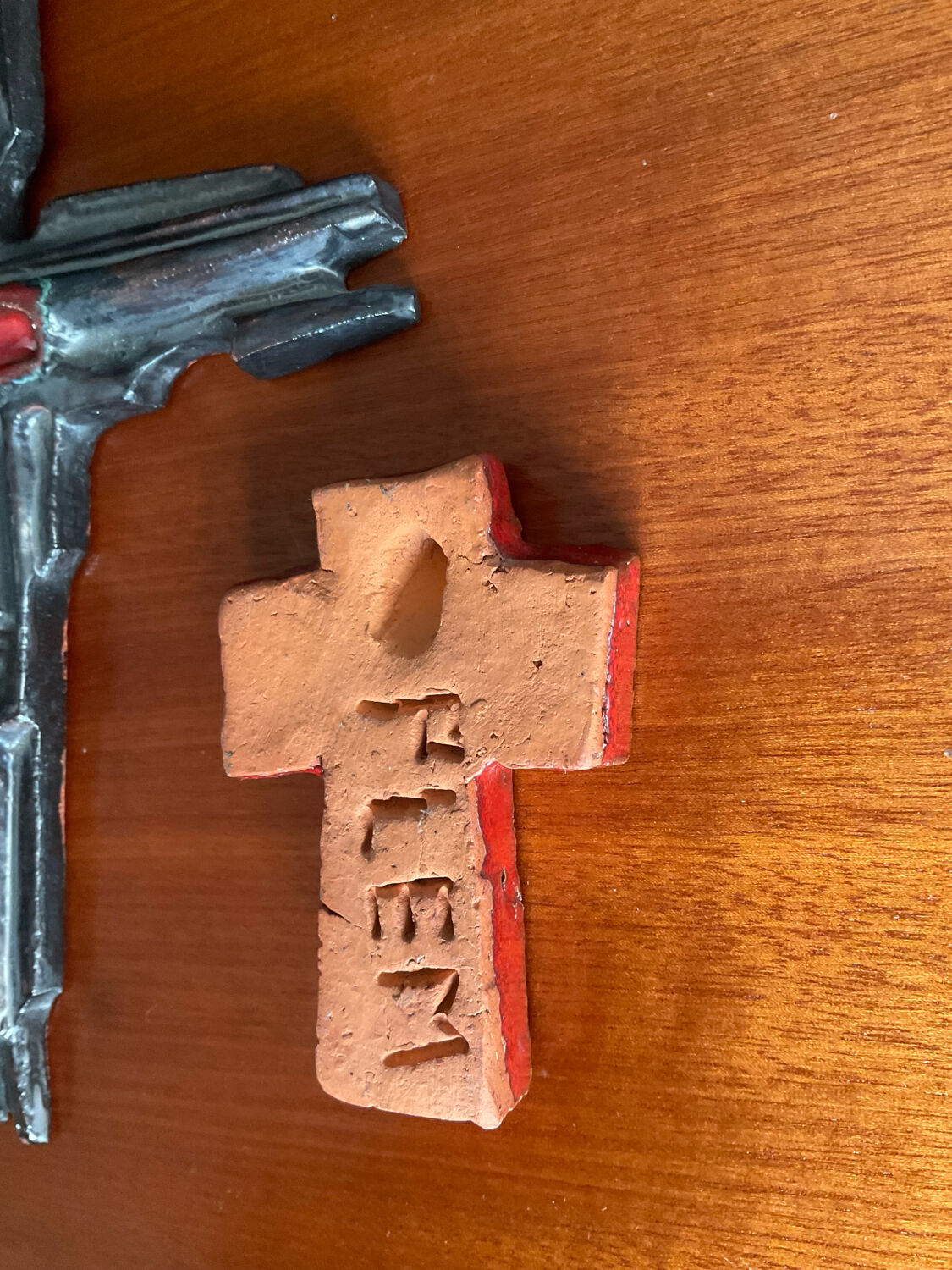 Vintage pair of glazed terracotta crosses