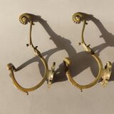 Pair of gilded bronze hooks Louis XVI style, nineteenth century.