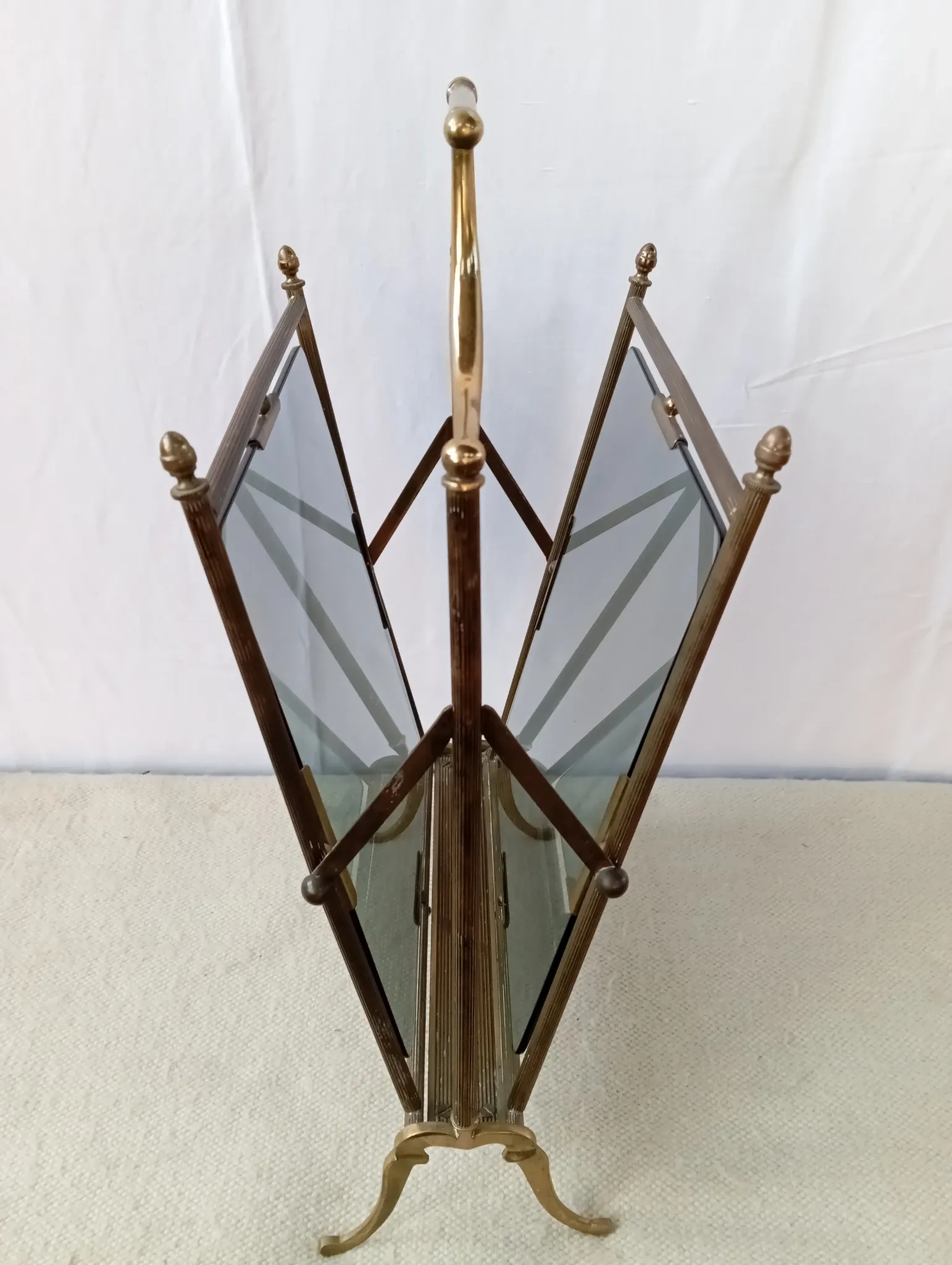 Neo-classical brass magazine rack in the spirit of Maison Jansen.