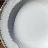 Twelve white porcelain plates