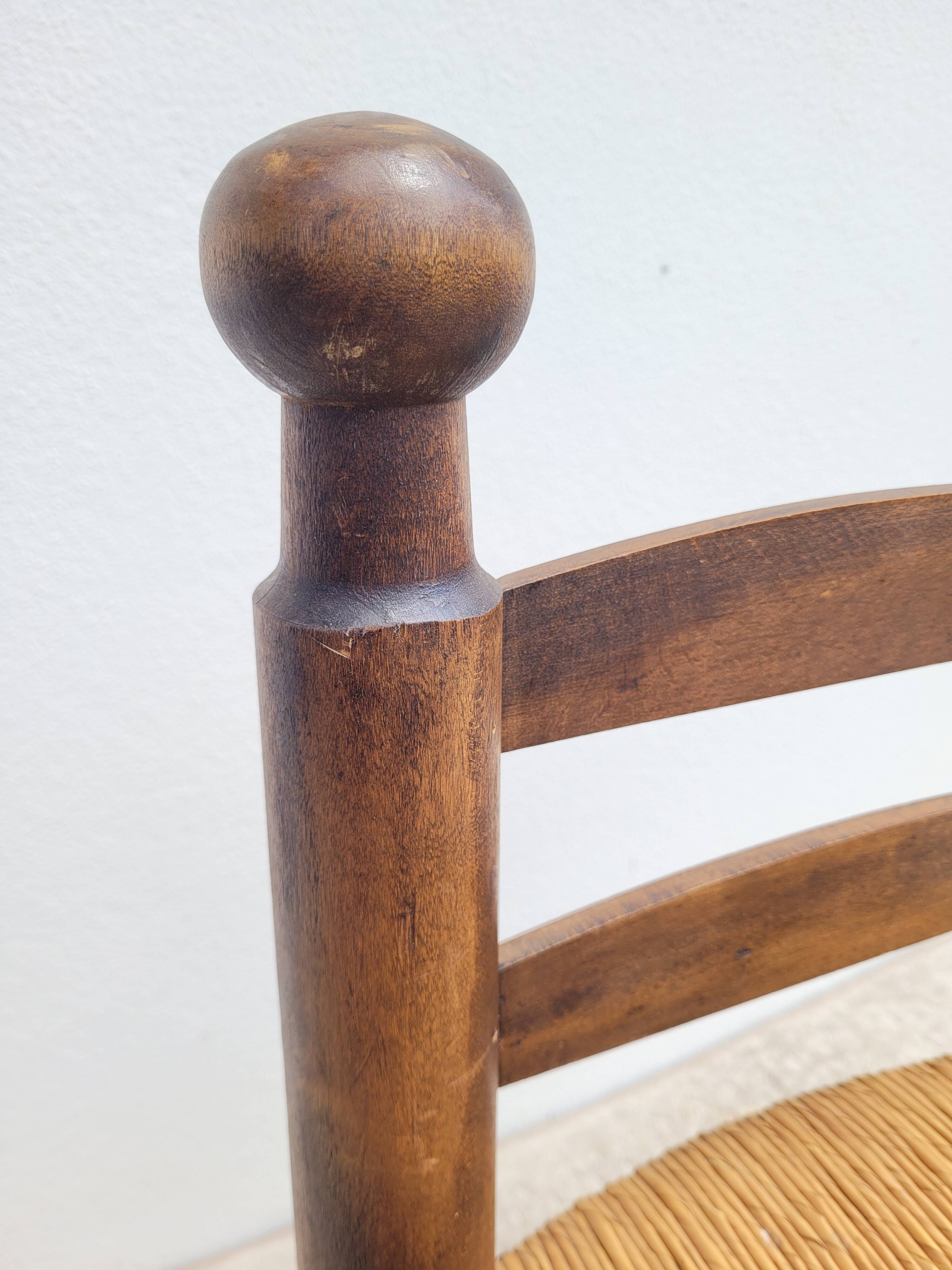 Low chair in turned wood and straw