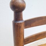 Low chair in turned wood and straw