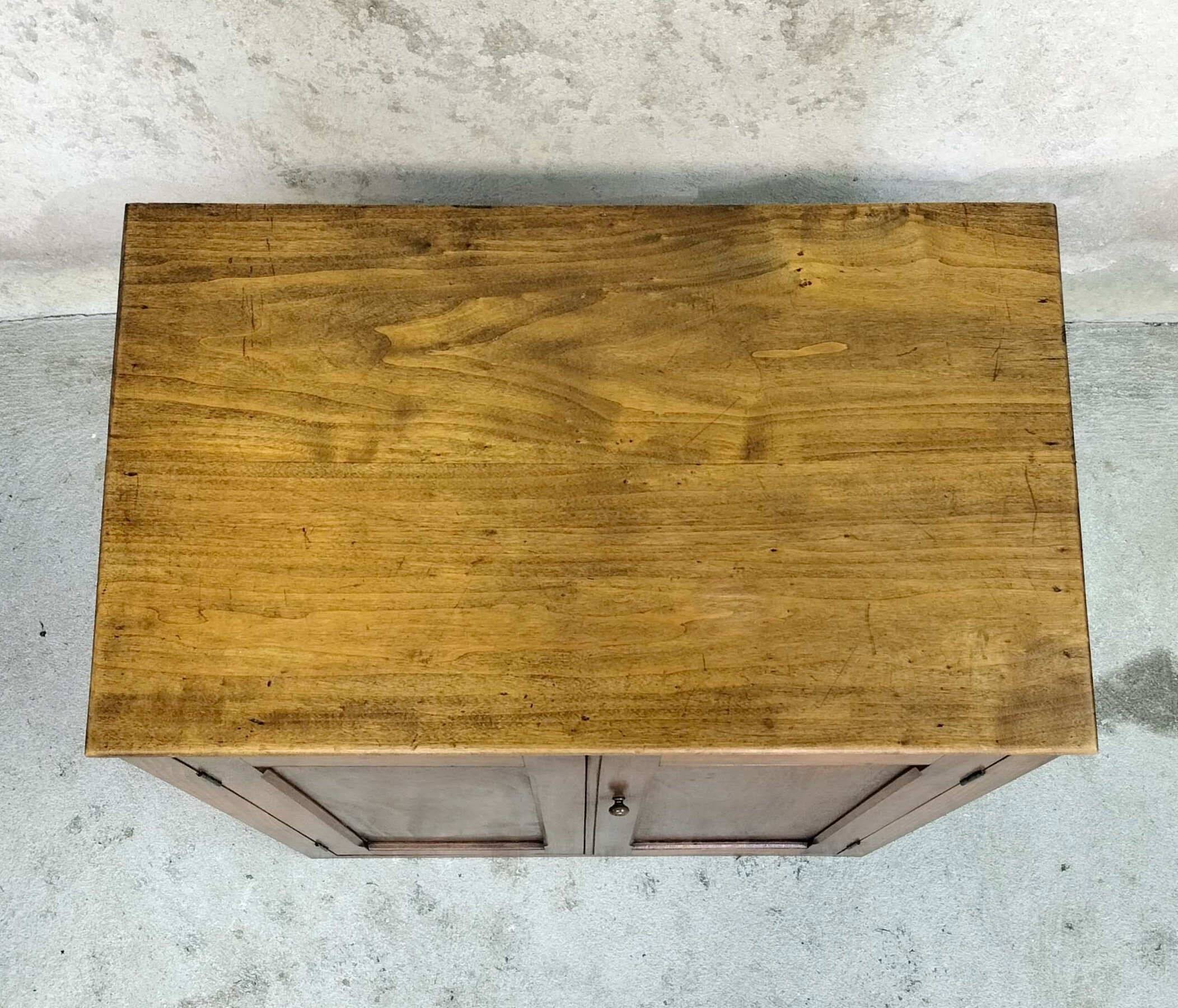 Small wooden sideboard with two doors.