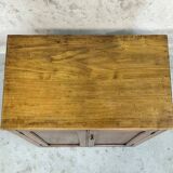 Small wooden sideboard with two doors.