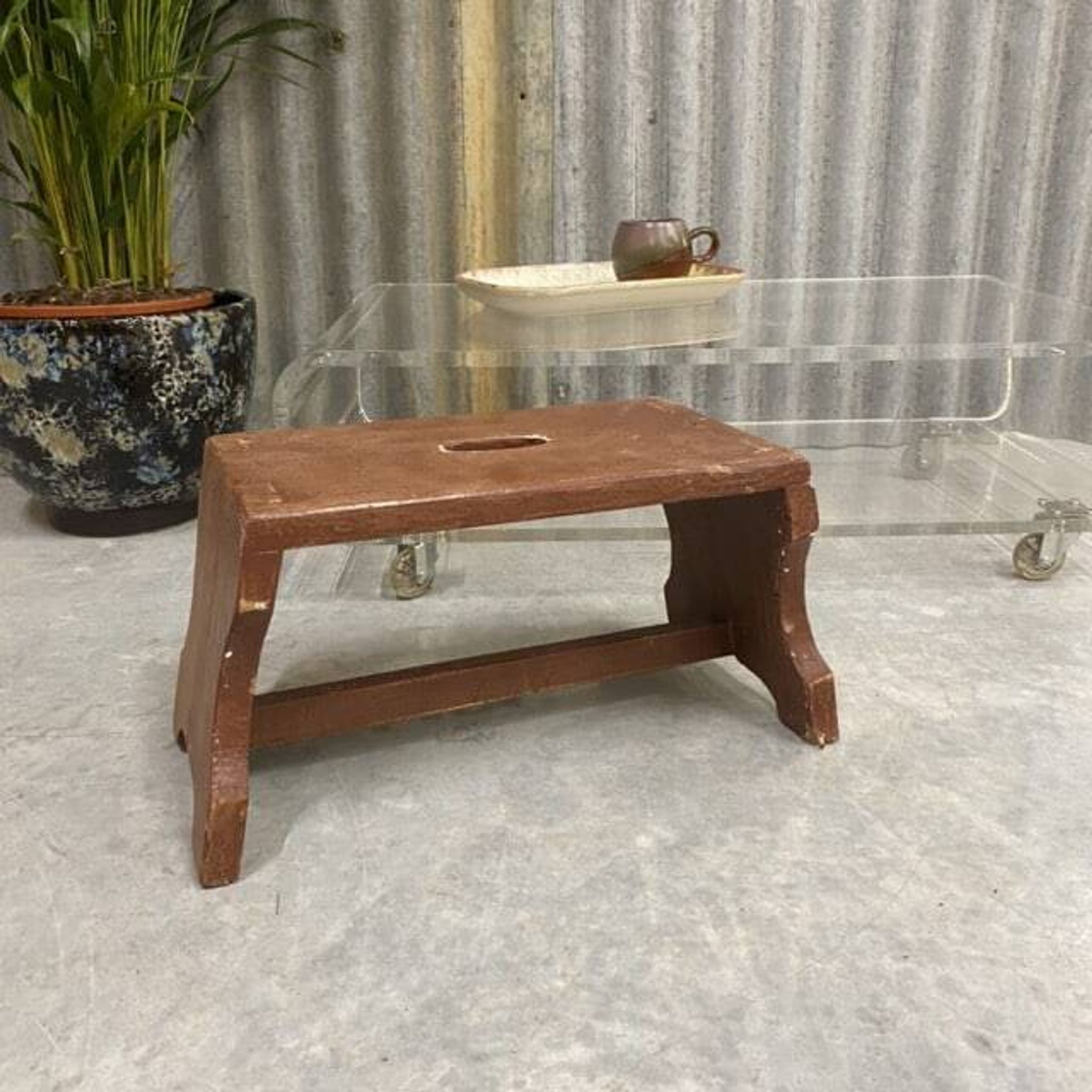 Small stool or Hungarian bench in wine red.