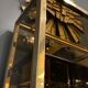 Hollywood Regency style bookcase shelf, gilded brass and black lacquered wood, 1970