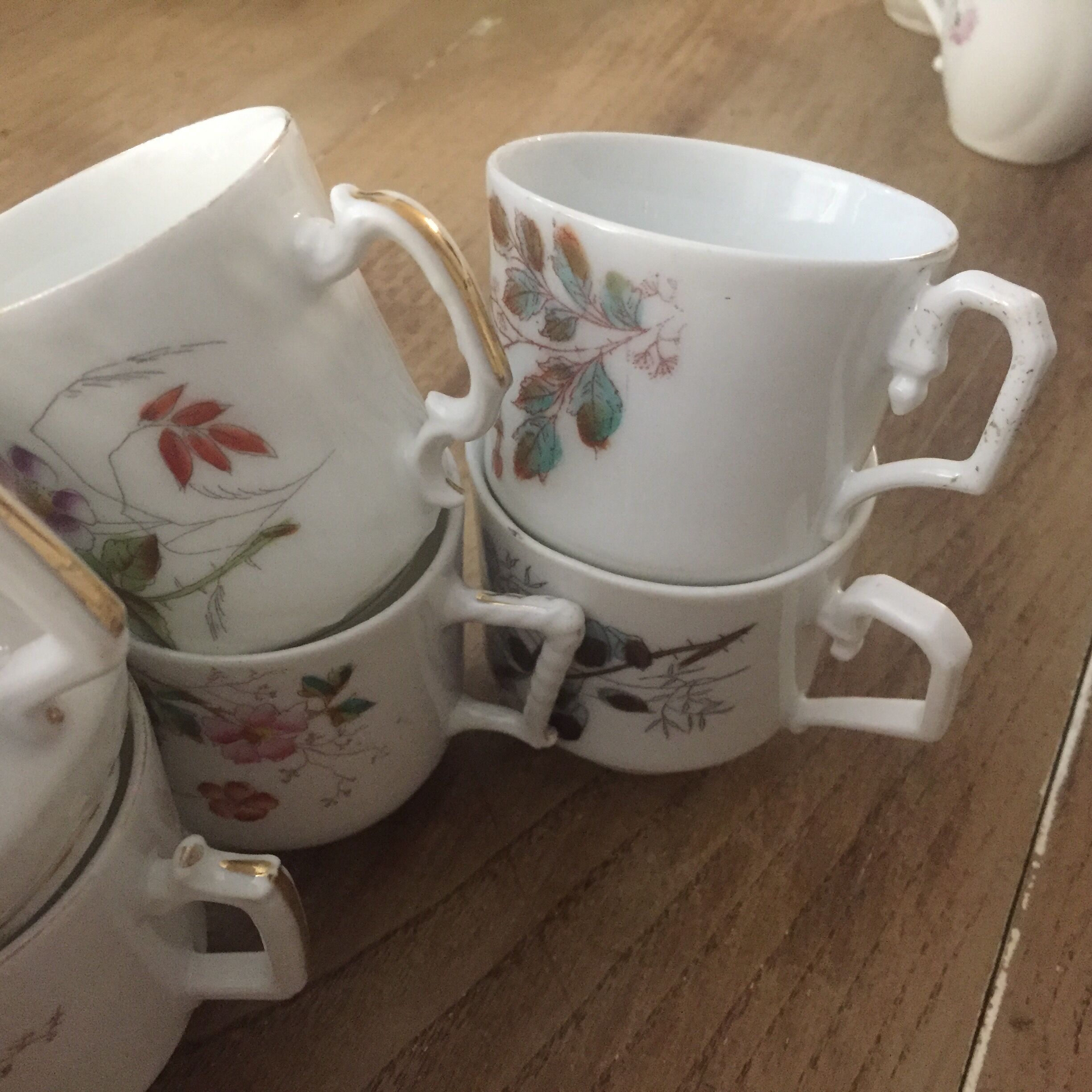 8 mismatched antique porcelain cups