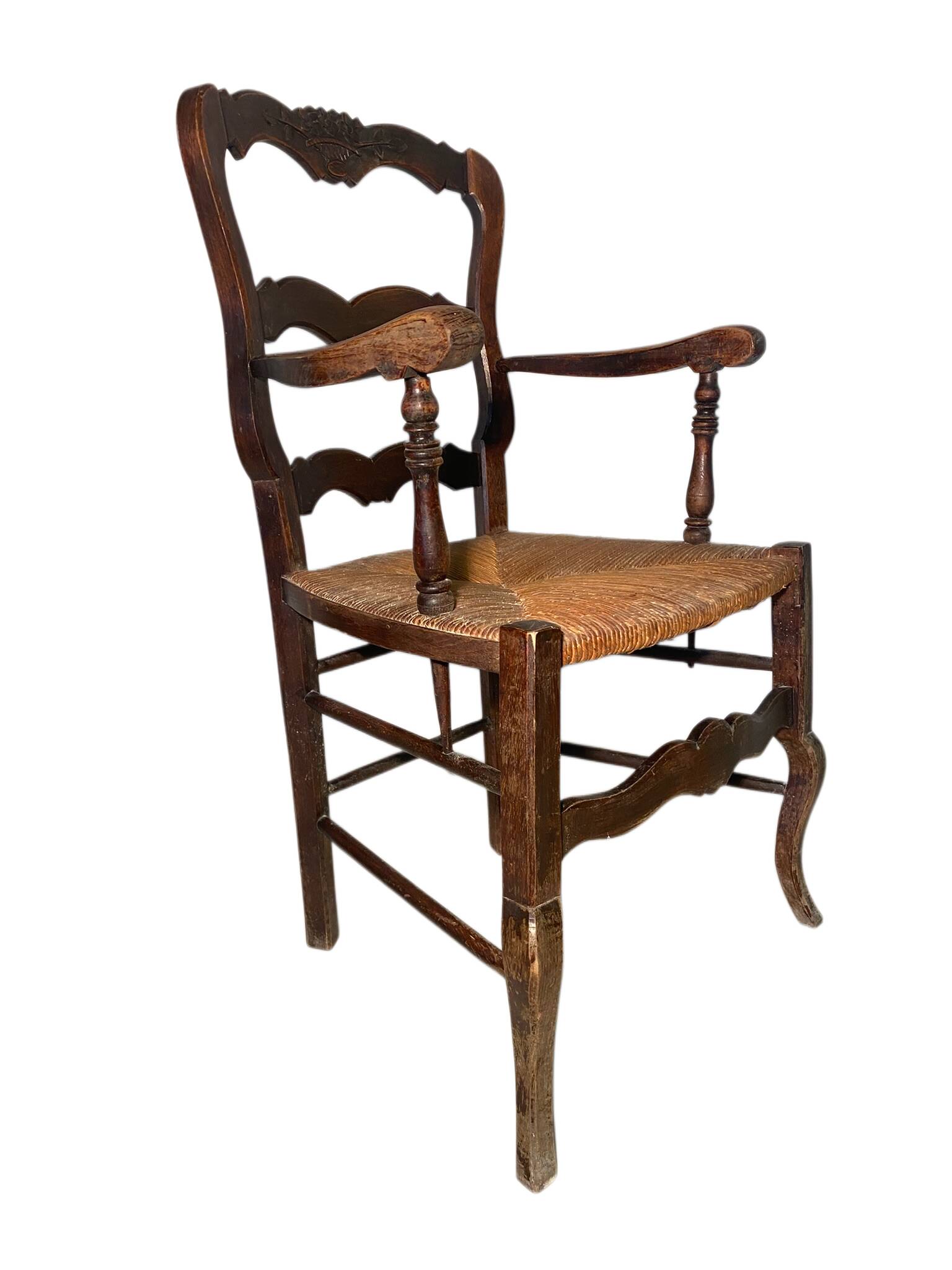 Antique Provencal armchair in carved wood with straw seat