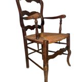 Fauteuil provençal ancien en bois sculpté avec assise en paille