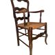 Antique Provencal armchair in carved wood with straw seat