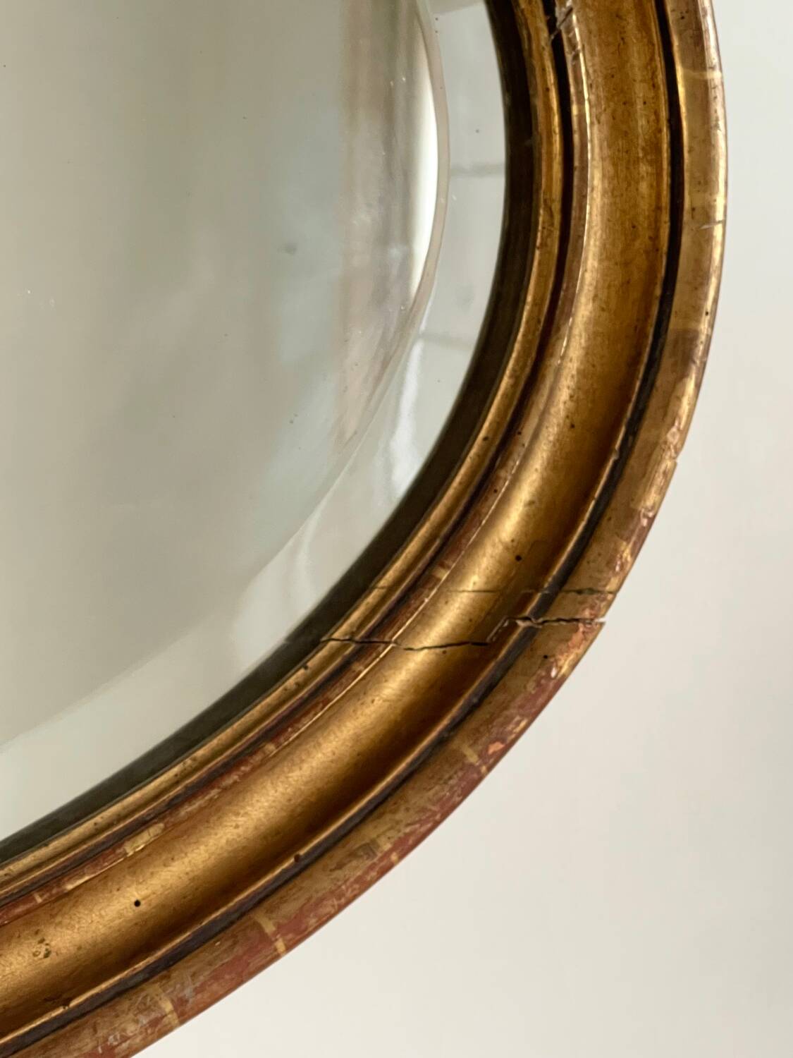 Antique oval gilt mirror.