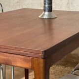 Extendable teak and teak veneer dining table