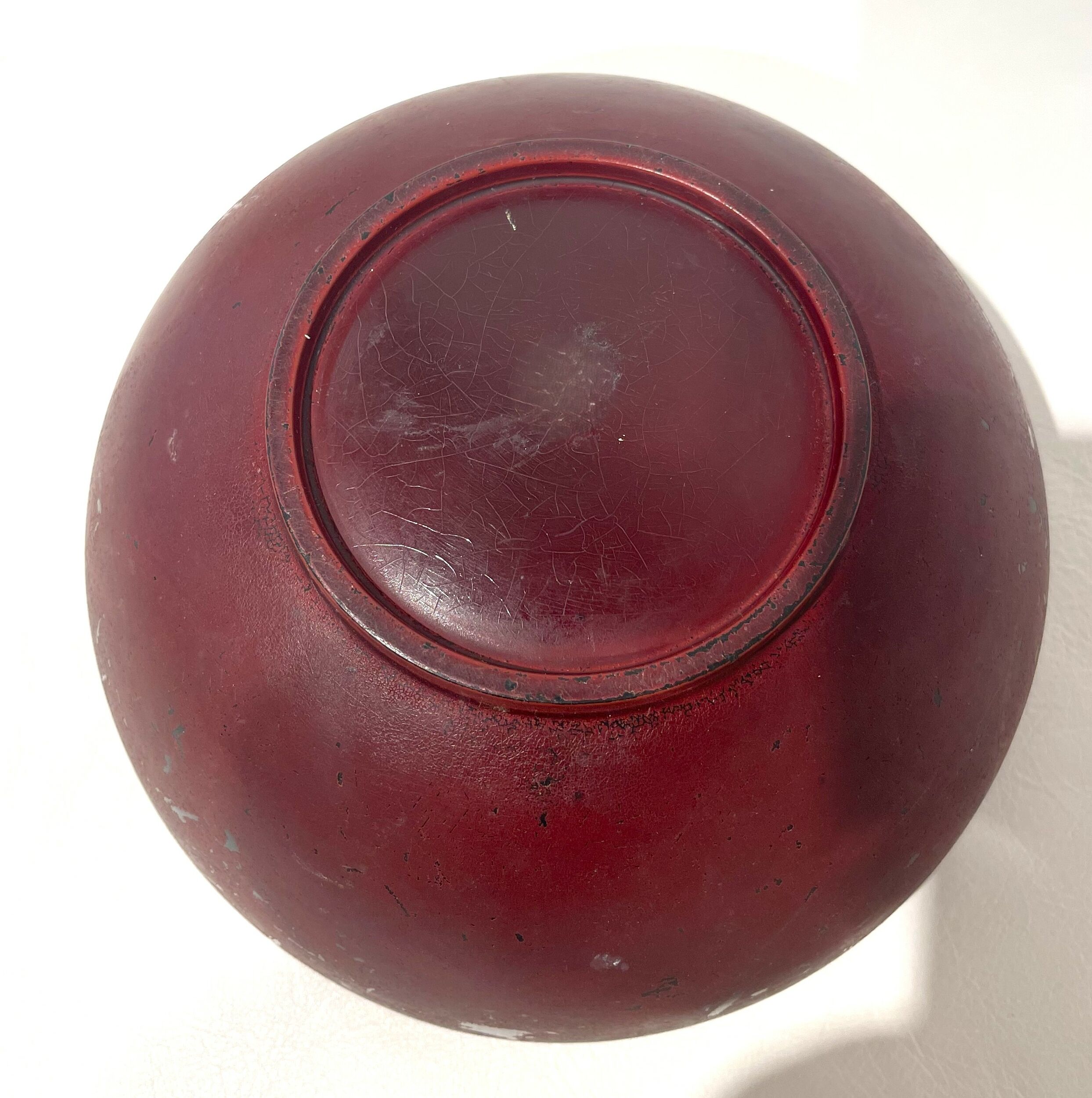 Vintage Japanese lacquered red coupe.