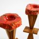 Two mid-century standing ashtrays consisting of red Alabaster cup