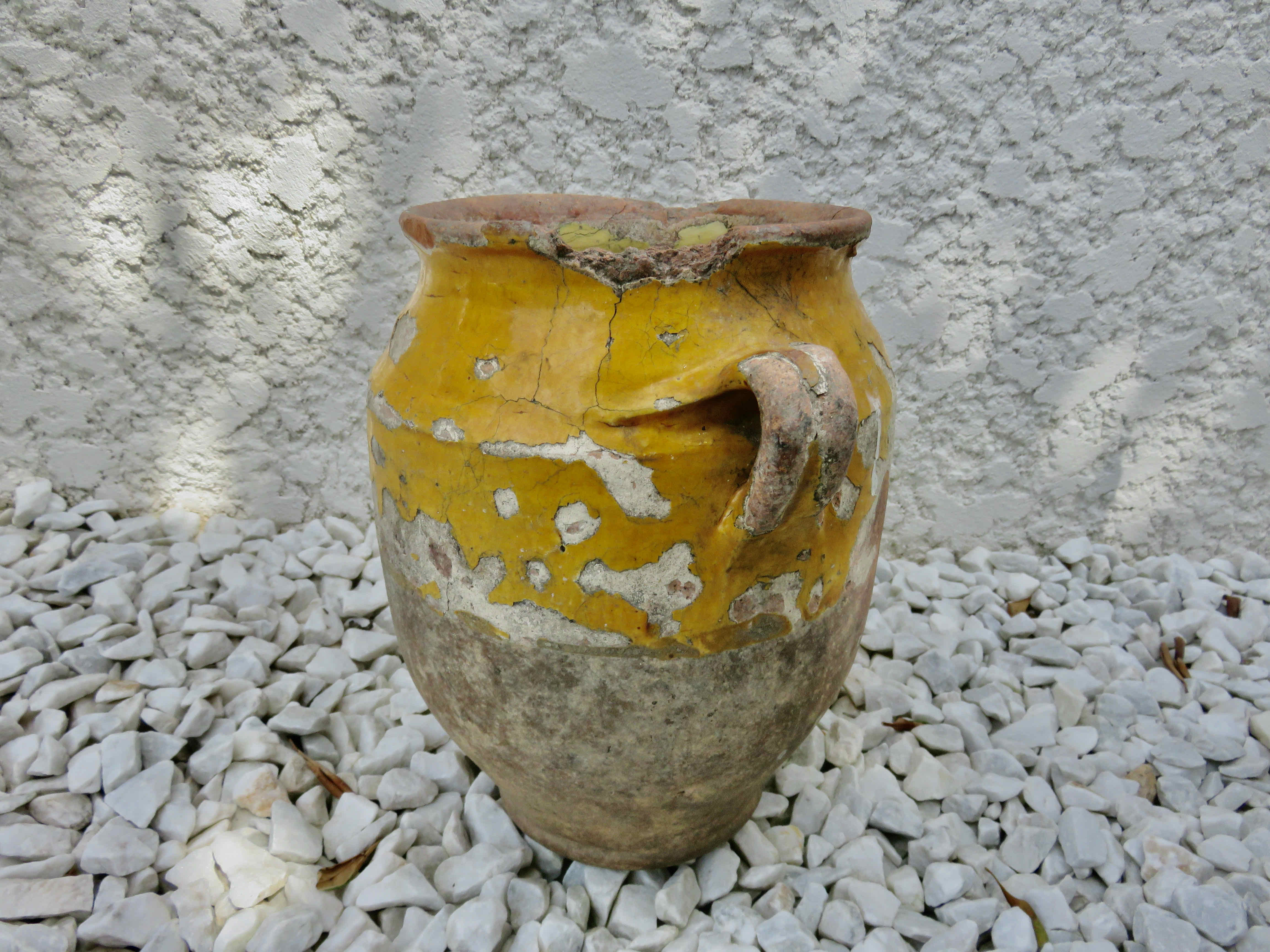 Old candied pot in yellow glazed terracotta XIX century