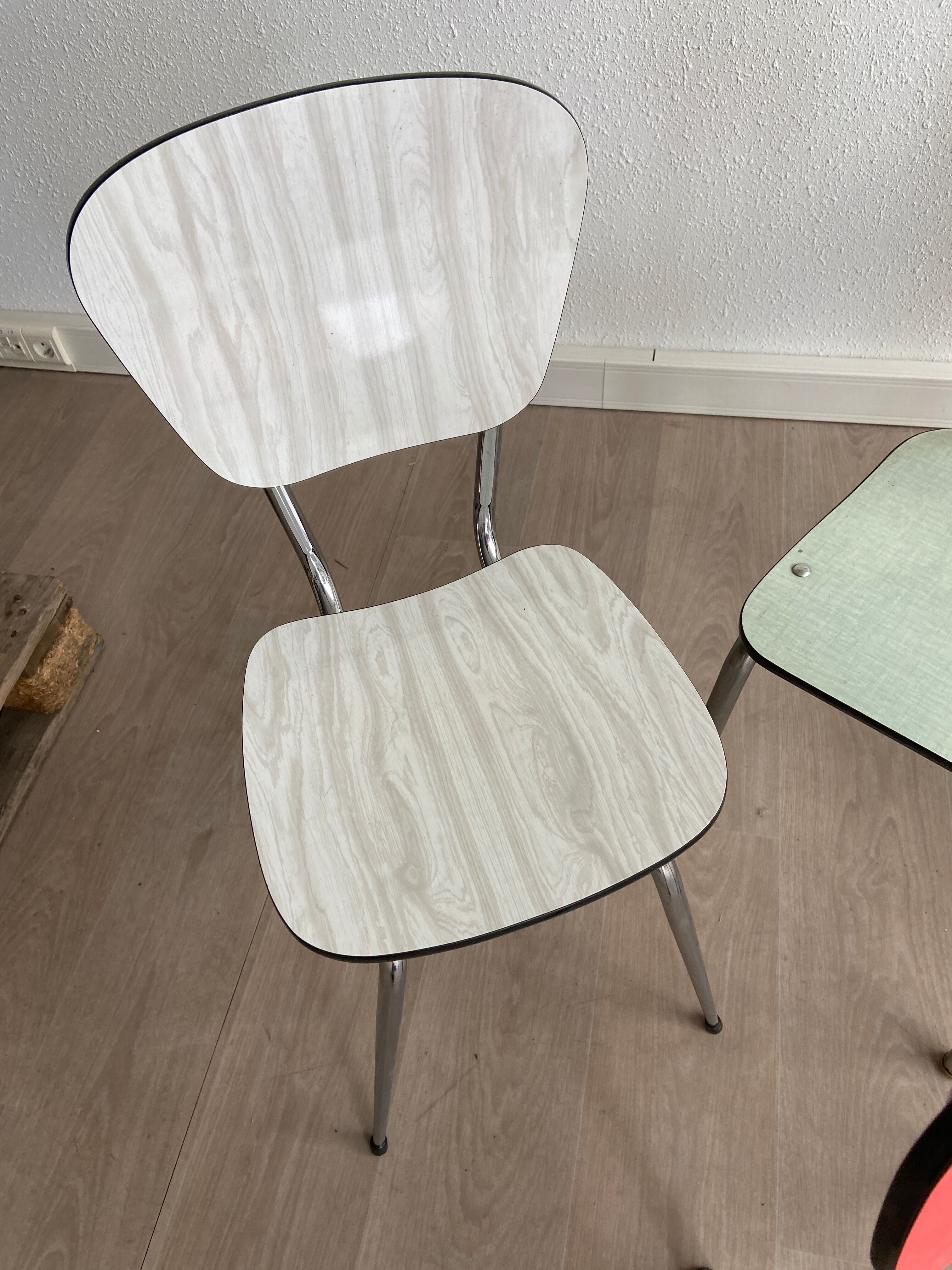 10 mismatched multicolored Formica chairs 60s