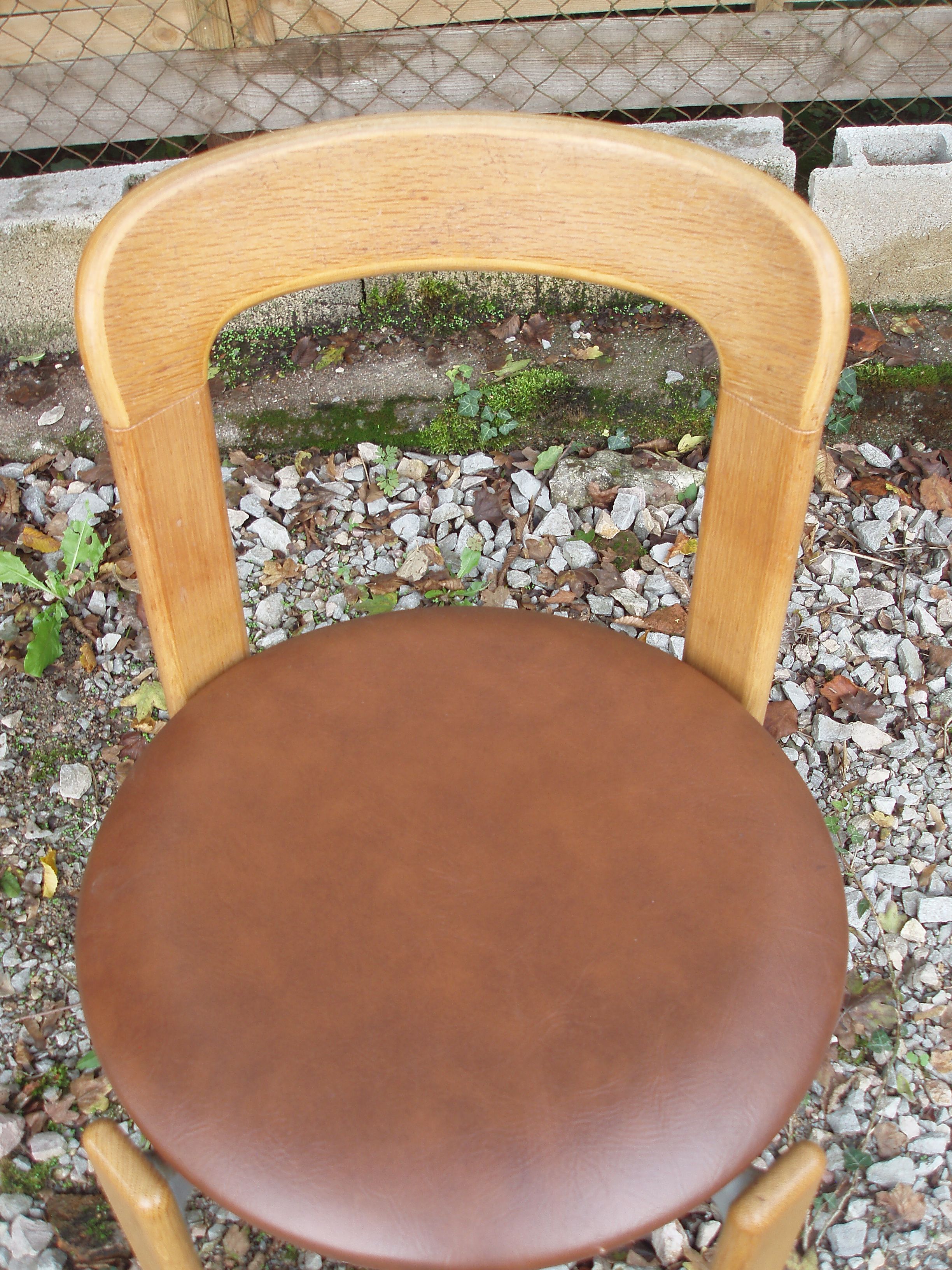 Pair of chairs by Swiss designer Bruno Rey in wood and brown skai