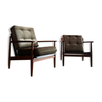 Two Scandinavian solid teak armchairs